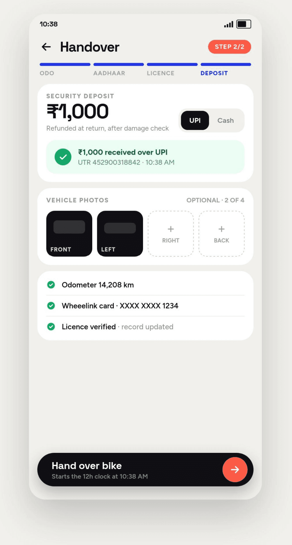 The Wheeelink handover flow on a phone, at the deposit step: a ₹1,000 security deposit received over UPI with its reference and timestamp, two of four optional vehicle photos taken, and a checklist confirming the odometer reading, the customer's Wheeelink card and a verified licence before the bike is handed over.